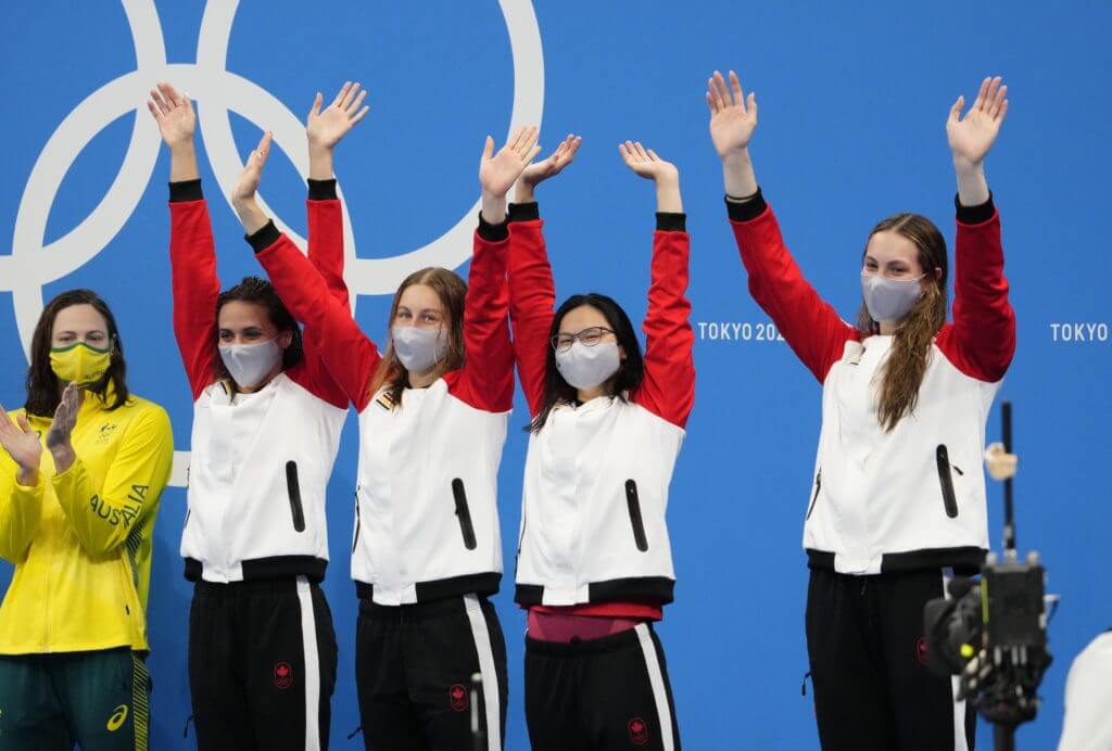 Aug 1, 2021; Tokyo, Japan; Canada celebrates their bronze medal during the medals ceremony for the women's 4x100m medley relay during the Tokyo 2020 Olympic Summer Games at Tokyo Aquatics Centre. Mandatory Credit: Rob Schumacher-USA TODAY Sports