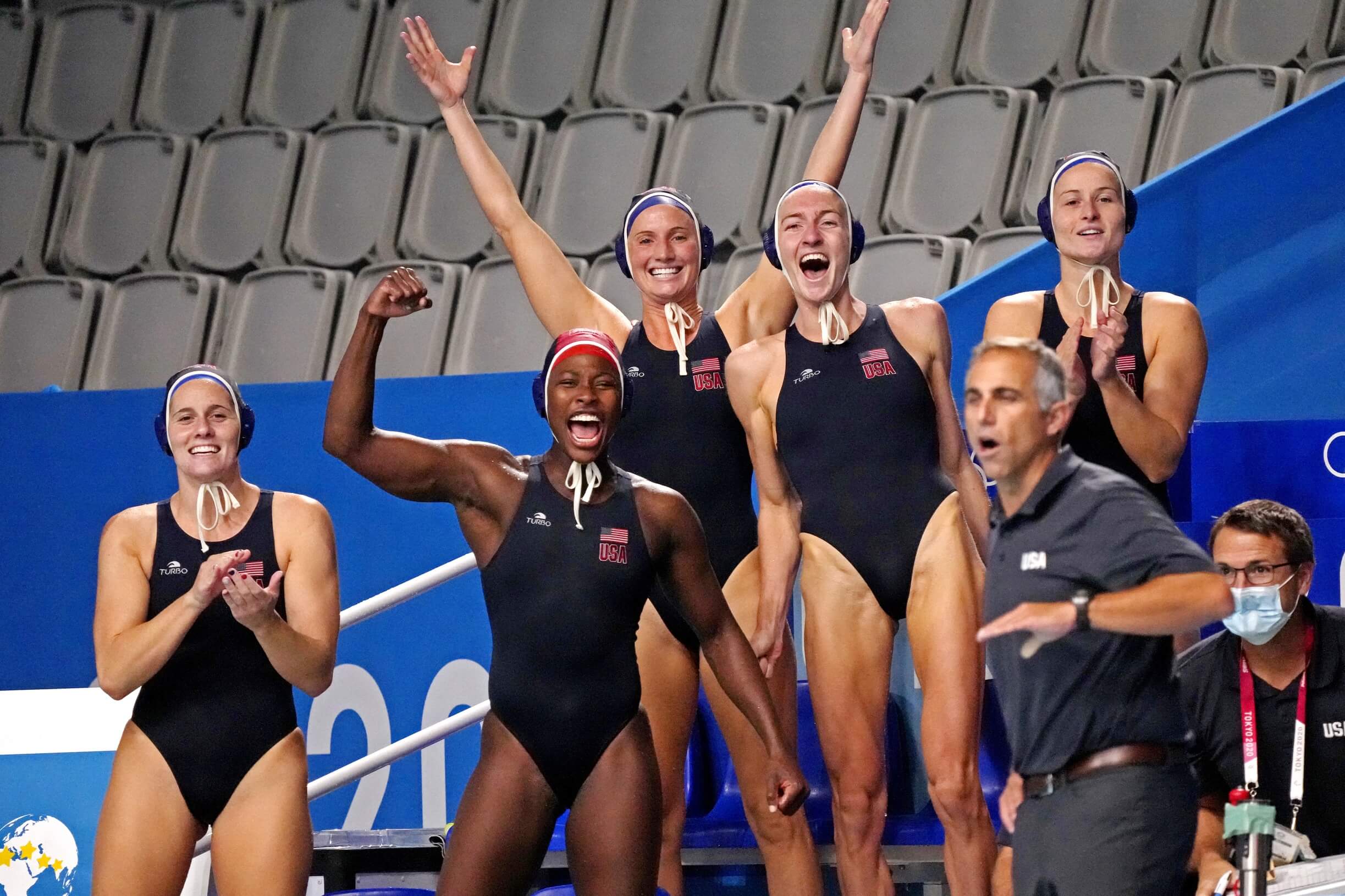 Aug 7, 2021; Tokyo, Japan; The United States bench cheers against Spain in the women's waterpolo gold medal match during the Tokyo 2020 Olympic Summer Games at Tatsumi Water Polo Centre. Mandatory Credit: Robert Deutsch-USA TODAY Sports