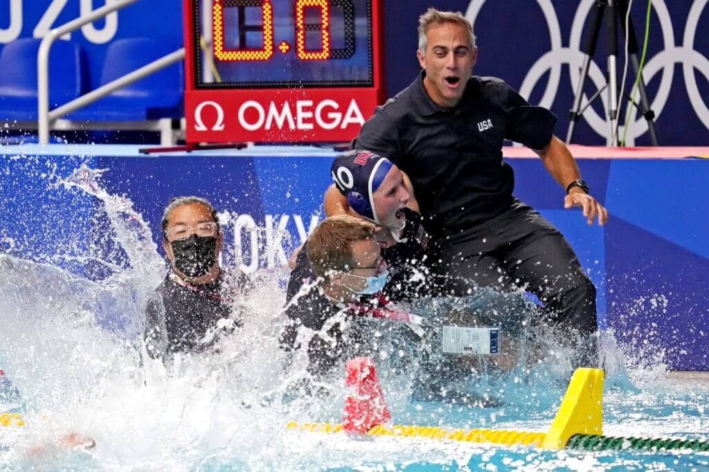 Aug 7, 2021; Tokyo, Japan; United States head coach Adam Krikorian is pushed in the pool after the United States beat Spain in the women's waterpolo gold medal match during the Tokyo 2020 Olympic Summer Games at Tatsumi Water Polo Centre. Mandatory Credit: Robert Deutsch-USA TODAY Sports