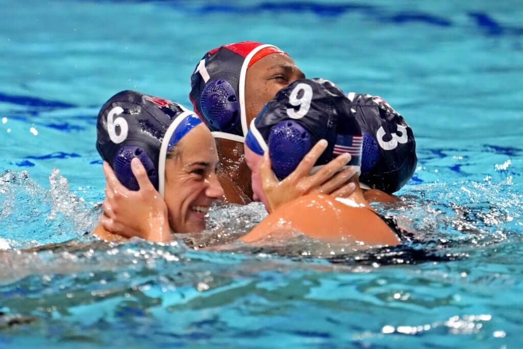 Aug 7, 2021; Tokyo, Japan; United States driver Margaret Steffens (6) and centre forward Aria Fischer (9) celebrates after beating Spain in the women's waterpolo gold medal match during the Tokyo 2020 Olympic Summer Games at Tatsumi Water Polo Centre. Mandatory Credit: Robert Deutsch-USA TODAY Sports