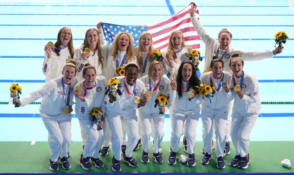 Aug 7, 2021; Tokyo, Japan; USA players celebrate with their gold medals after the women's water polo gold medal match against Spain during the Tokyo 2020 Olympic Summer Games at Tatsumi Water Polo Centre. Mandatory Credit: Robert Deutsch-USA TODAY Sports