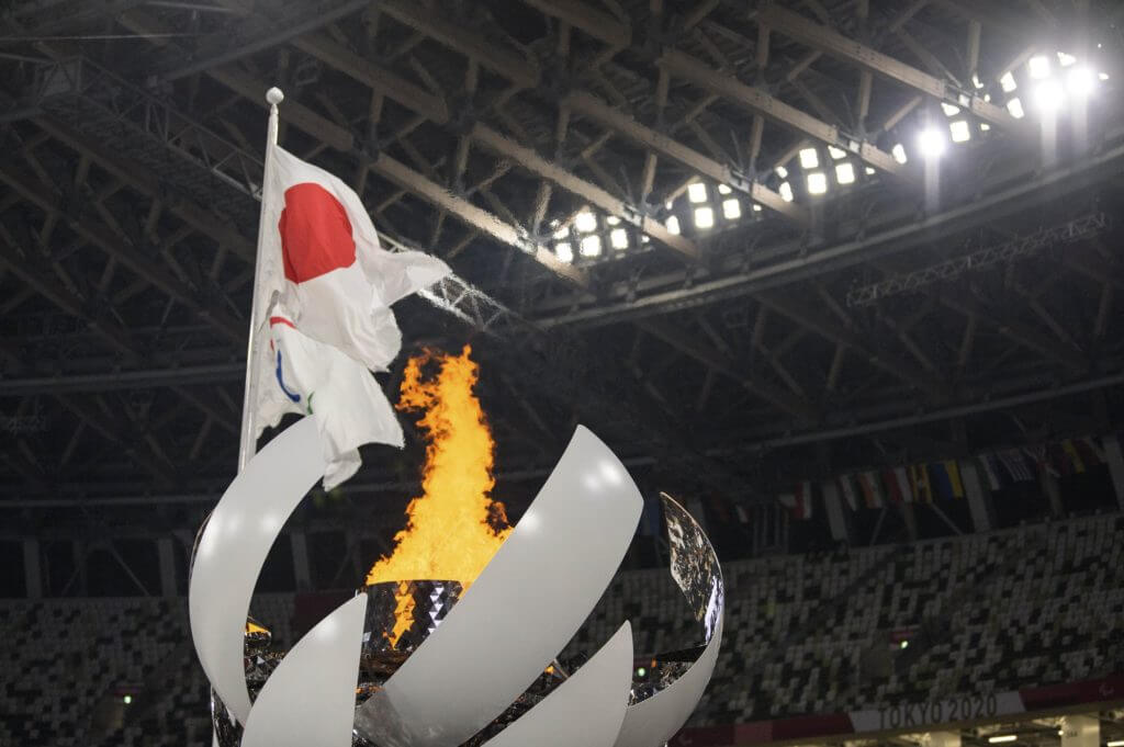 Aug 24, 2021; Tokyo, Japan; The national flag of Japan and the Paralympic flag behind the Paralympic flame at the end of the Opening Ceremony of the Tokyo 2020 Paralympic Games. Mandatory Credit: Joel Marklund/OIS Handout Photo via USA TODAY Sports