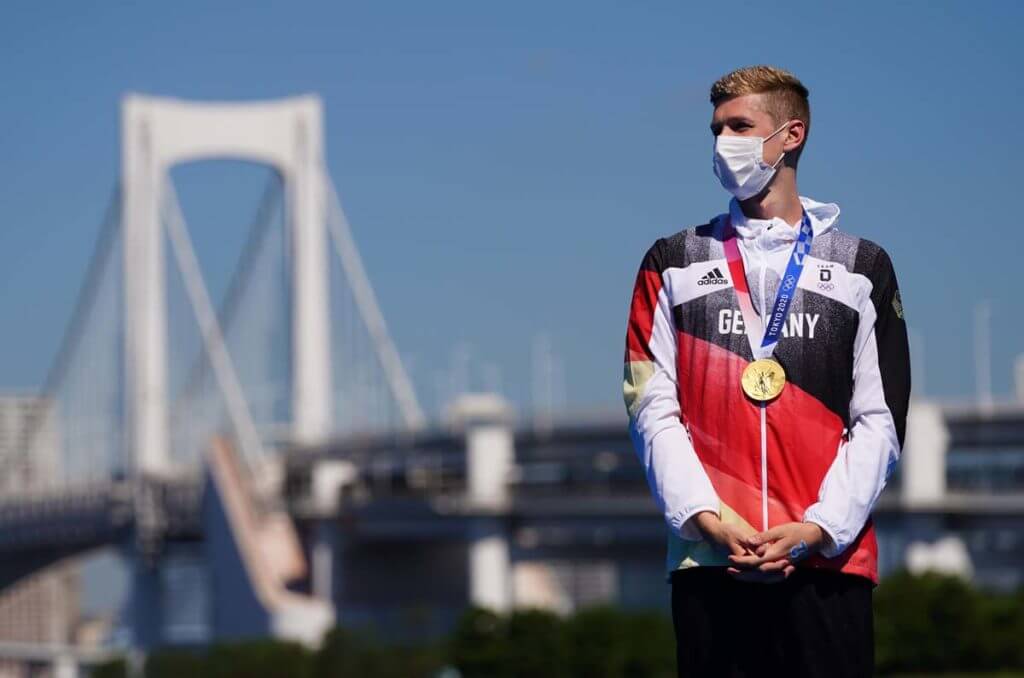 Aug 5, 2021; Tokyo, Japan; Florian Wellbrock (GER) wears his gold medal after the men's 10km marathon swimming competition during the Tokyo 2020 Olympic Summer Games at Odaiba Marine Park. Mandatory Credit: Kareem Elgazzar-USA TODAY Sports