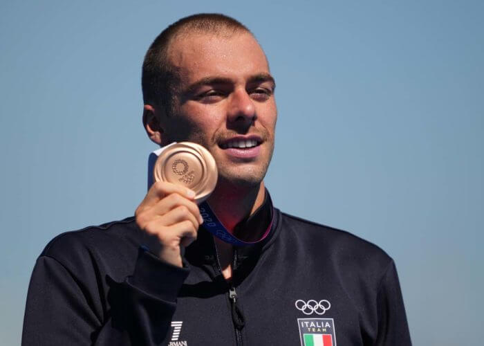 Aug 5, 2021; Tokyo, Japan; Gregorio Paltrinieri (ITA) shows off his bronze medal after the men's 10km marathon swimming competition during the Tokyo 2020 Olympic Summer Games at Odaiba Marine Park. Mandatory Credit: Kareem Elgazzar-USA TODAY Sports