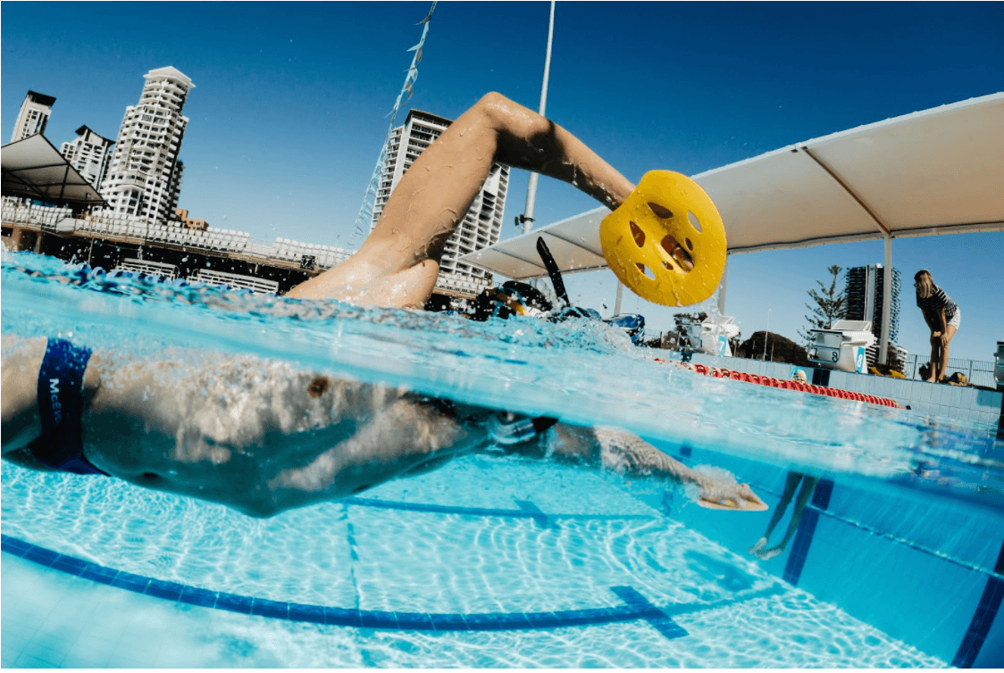 Swimmer with FINIS Manta Paddles