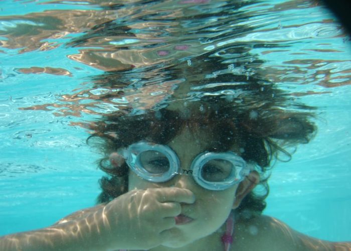 little-girl-swimming-underwater