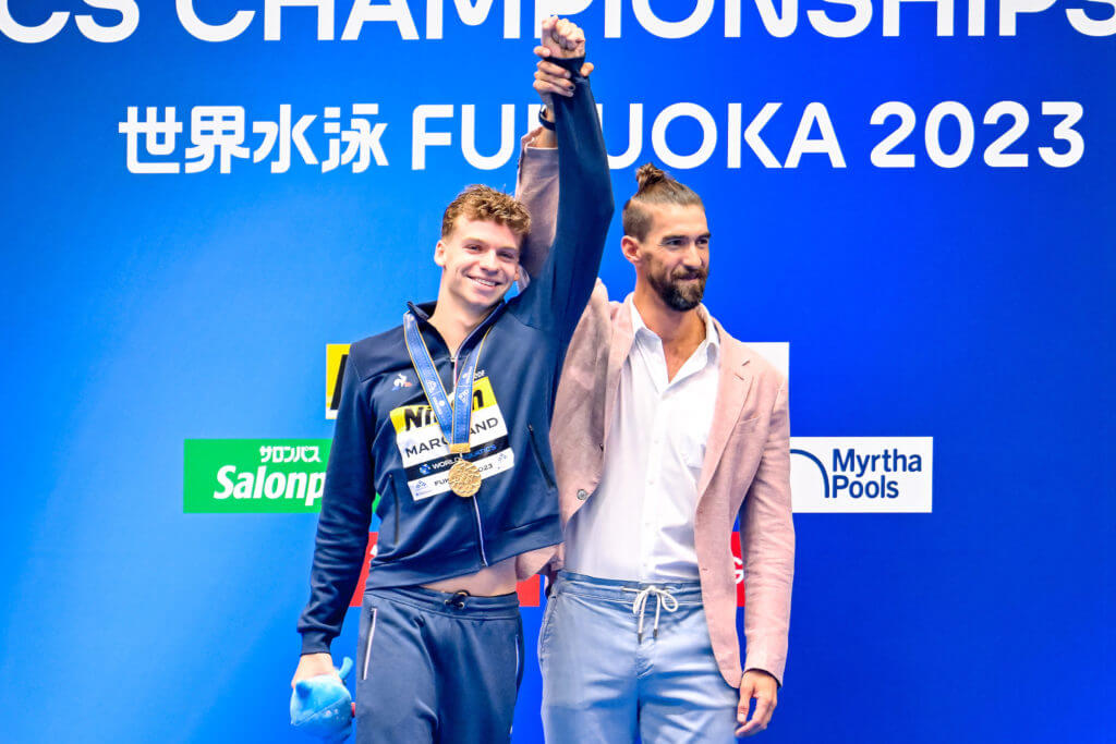 Leon Marchand of France and Michael Phelps attend the medal ceremony of the 400m Individual Medley Men Final during the 20th World Aquatics Championships at the Marine Messe Hall A in Fukuoka (Japan), July 23rd, 2023.