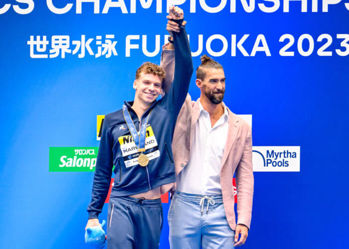 Leon Marchand of France and Michael Phelps attend the medal ceremony of the 400m Individual Medley Men Final during the 20th World Aquatics Championships at the Marine Messe Hall A in Fukuoka (Japan), July 23rd, 2023.
