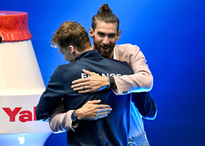 Former swimmer Michael Phelps greets Leon Marchand of Franceat the end of the 400m Individual Medley Men Final during the 20th World Aquatics Championships at the Marine Messe Hall A in Fukuoka (Japan), July 23rd, 2023. Leon Marchand placed first winning the gold medal with a new world record.