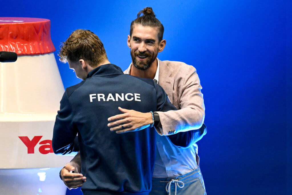 Former swimmer Michael Phelps greets Leon Marchand of Franceat the end of the 400m Individual Medley Men Final during the 20th World Aquatics Championships at the Marine Messe Hall A in Fukuoka (Japan), July 23rd, 2023. Leon Marchand placed first winning the gold medal with a new world record.