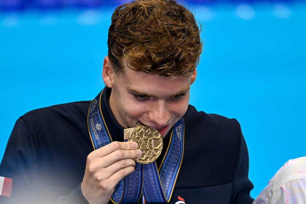 Leon Marchand of France celebrates with the medal after the 400m Individual Medley Men Final during the 20th World Aquatics Championships at the Marine Messe Hall A in Fukuoka (Japan), July 23rd, 2023. Leon Marchand placed first winning the gold medal with a new world record.