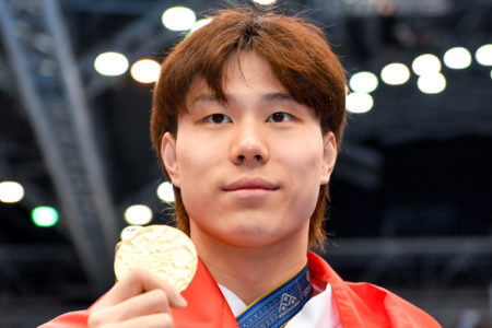 Haiyang Qin of China shows the gold medal after competing in the 200m Breaststroke Men Final with a New World Record during the 20th World Aquatics Championships at the Marine Messe Hall A in Fukuoka (Japan), July 28th, 2023.