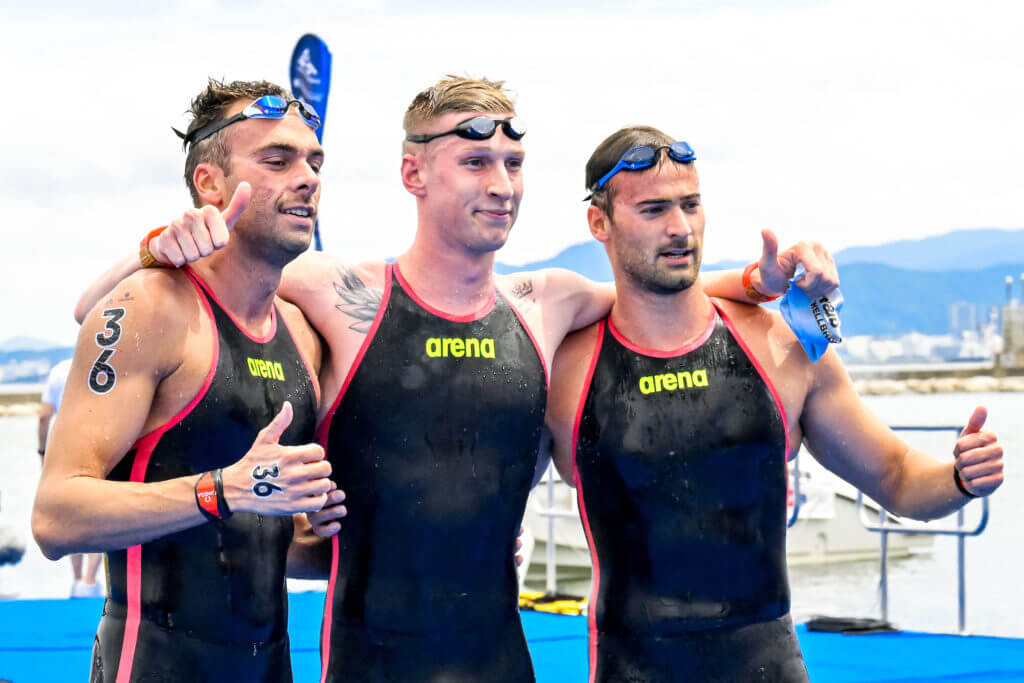 Gregorio Paltrinieri of Italy, silver, Florian Wellbrock of Germany, gold, Domenico Acerenza of Italy, bronze react after competing in the 5km Men during the 20th World Aquatics Championships at the Seaside Momochi Beach Park in Fukuoka (Japan), July 18th, 2023.