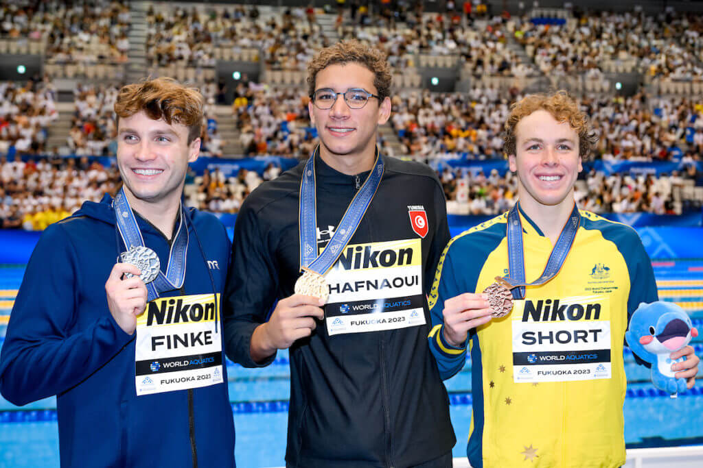 Bobby Finke of the United States of America, silver, Ahmed Hafnaoui of Tunisia, gold, Samuel Short of Australia, bronze show the medals after competing in the 1500m Freestyle Men Final during the 20th World Aquatics Championships at the Marine Messe Hall A in Fukuoka (Japan), July 30th, 2023.