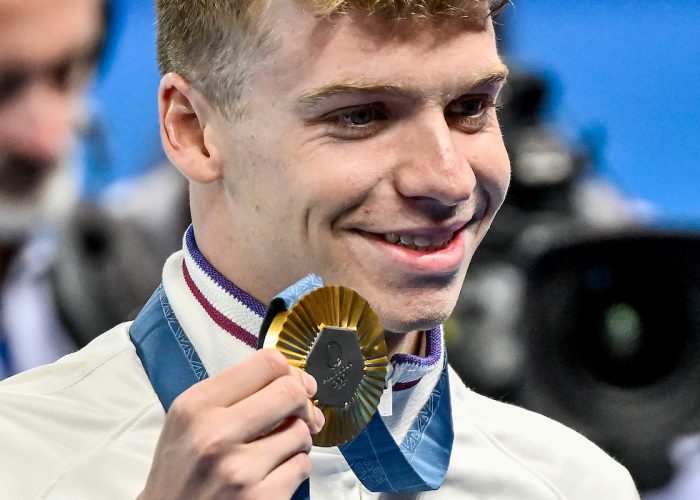 Leon Marchand of France shows the gold medal after competing in the Men's 400m Individual Medley final during the Paris 2024 Olympic Games at La Defense Arena in Paris (France), July 28, 2024.