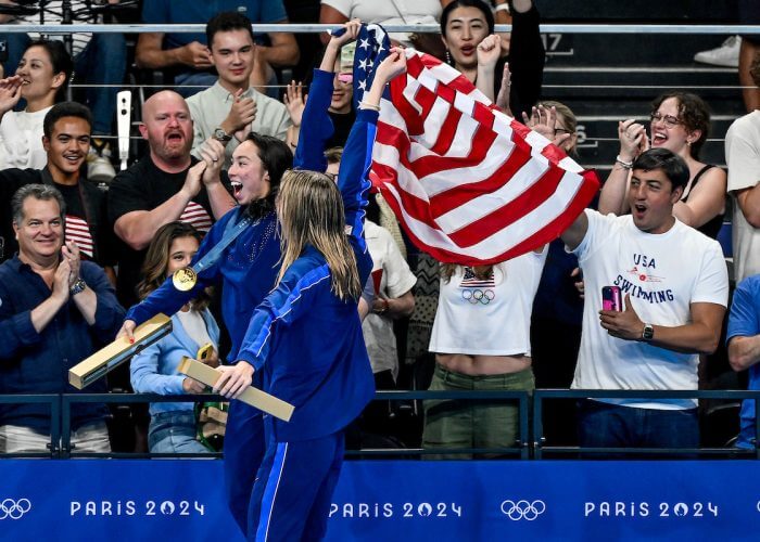 Torri Huske and Gretchen Walsh of United States celebrates after winning the gold and silver medal in the Women's 100m Butterfly final during the Paris 2024 Olympic Games at La Defense Arena in Paris (France), July 28, 2024.