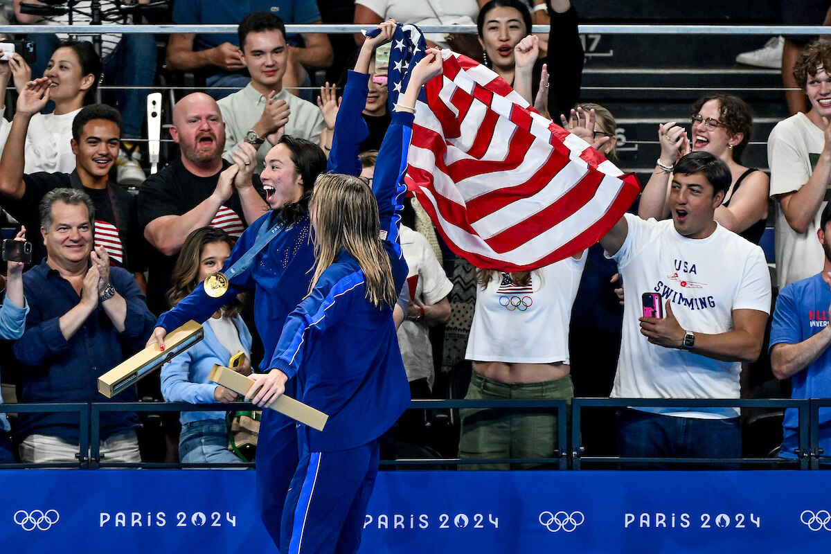 Torri Huske and Gretchen Walsh of United States celebrates after winning the gold and silver medal in the Women's 100m Butterfly final during the Paris 2024 Olympic Games at La Defense Arena in Paris (France), July 28, 2024.