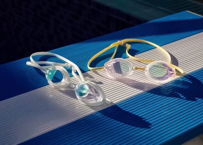 hydroclear goggles sitting on a diving board