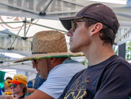 Swim-tech innovator analyzing data on the pool deck during training